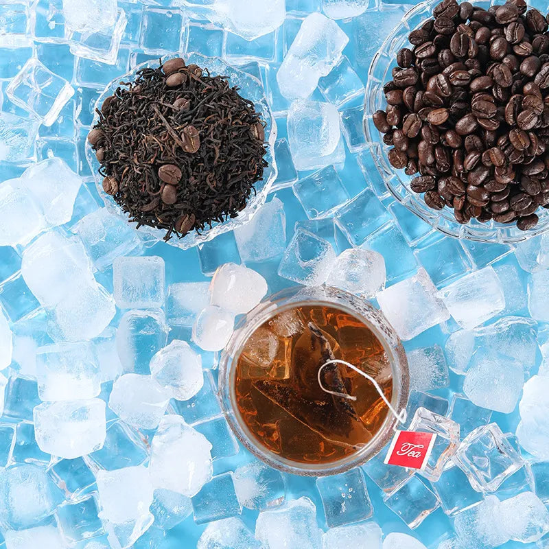 Dry pu-erh coffee tea leaves in a glass bowl surrounded by ice cubes.