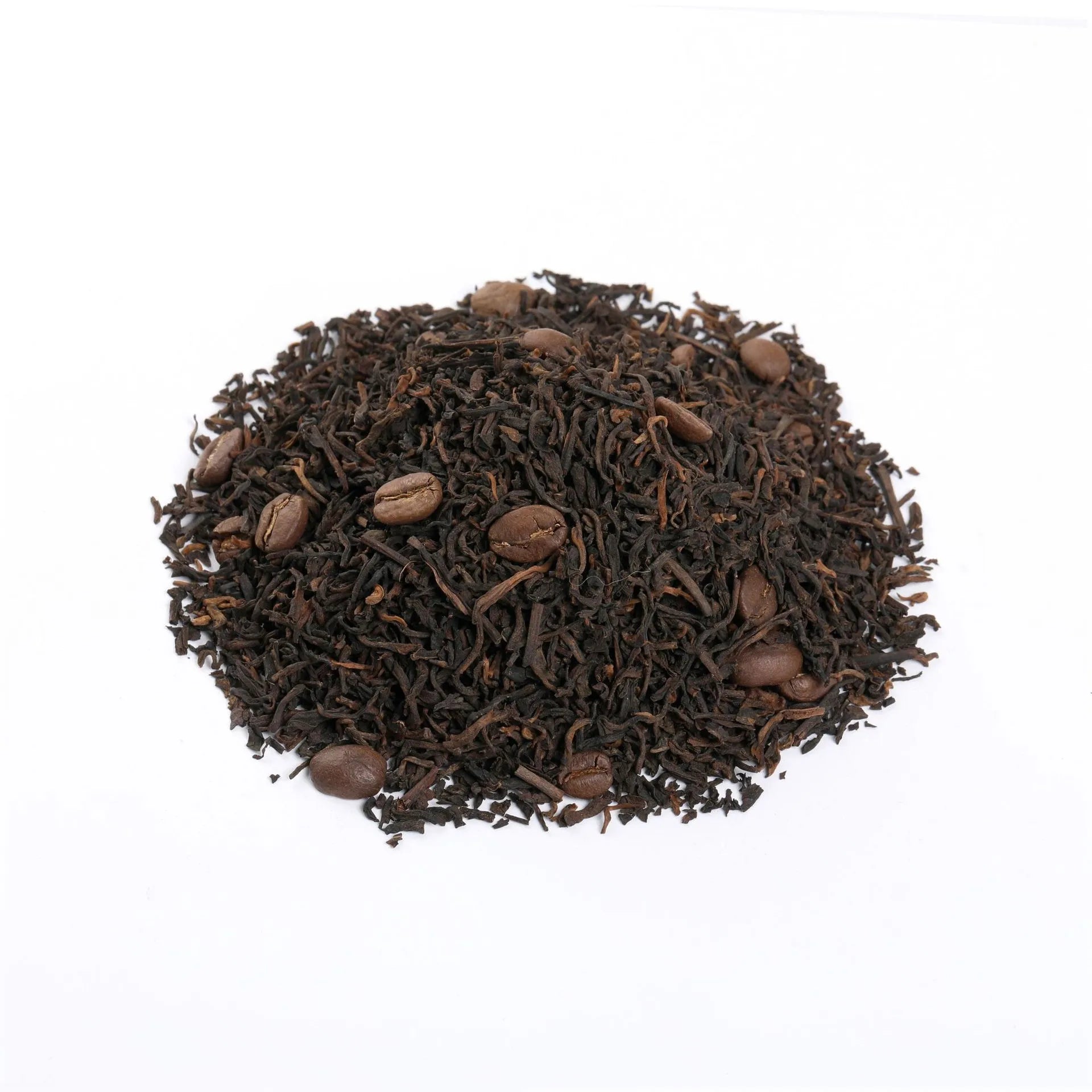 Dry pu-erh coffee tea leaves on a white background showing mixed texture of tea and coffee beans.