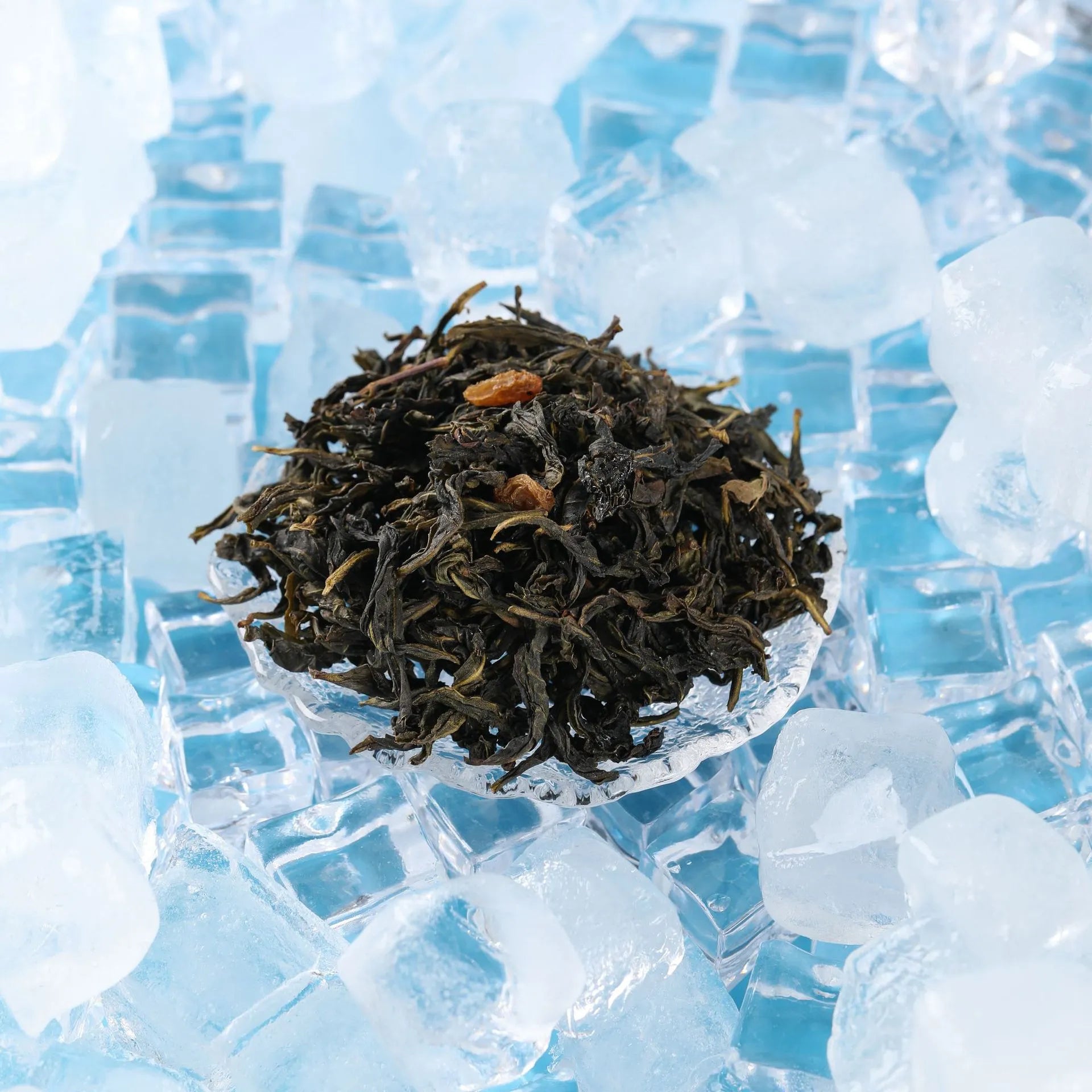 Close-up of dried grape oolong tea leaves on ice for cold brew