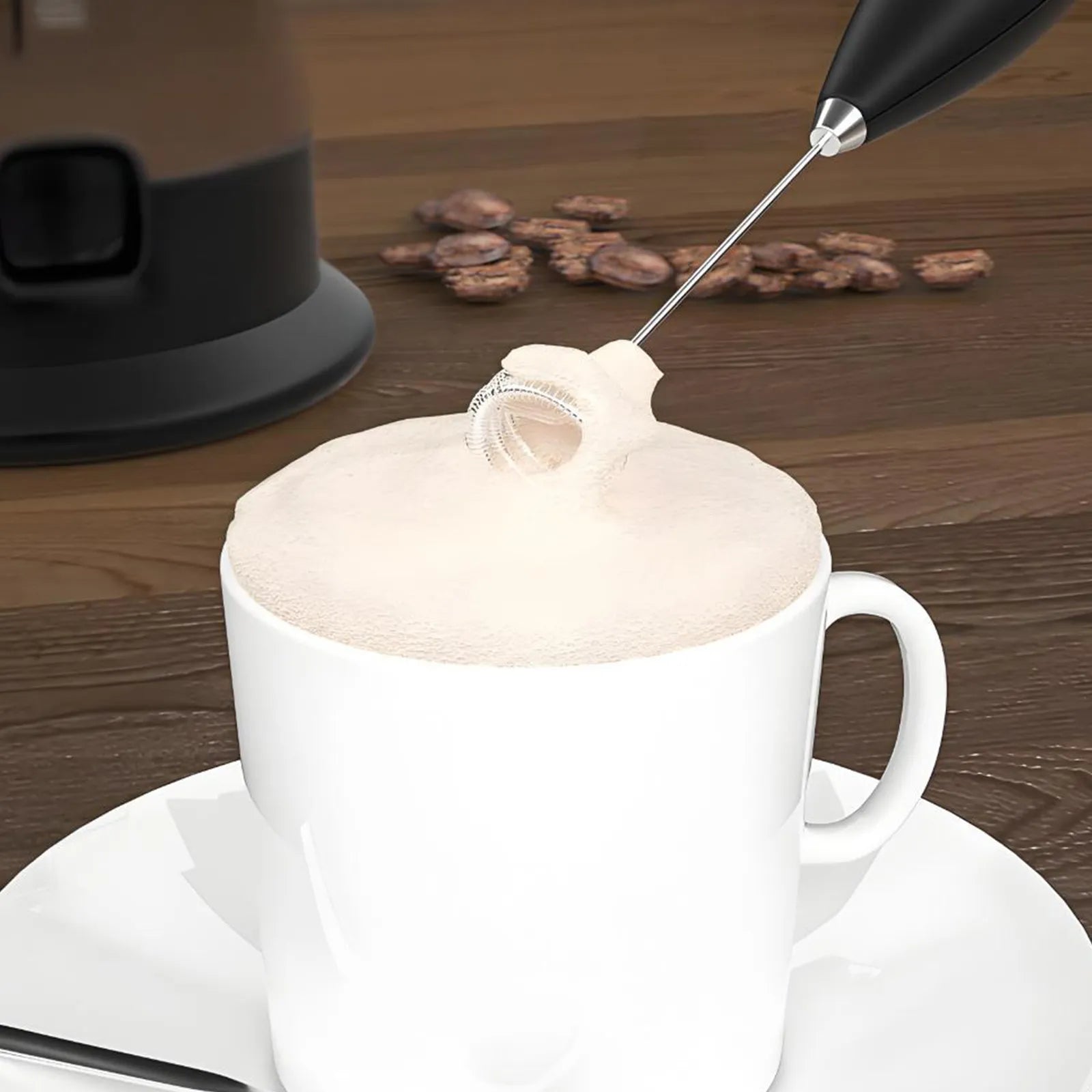 Leafmill electric milk frother creating thick foam in a white ceramic coffee mug