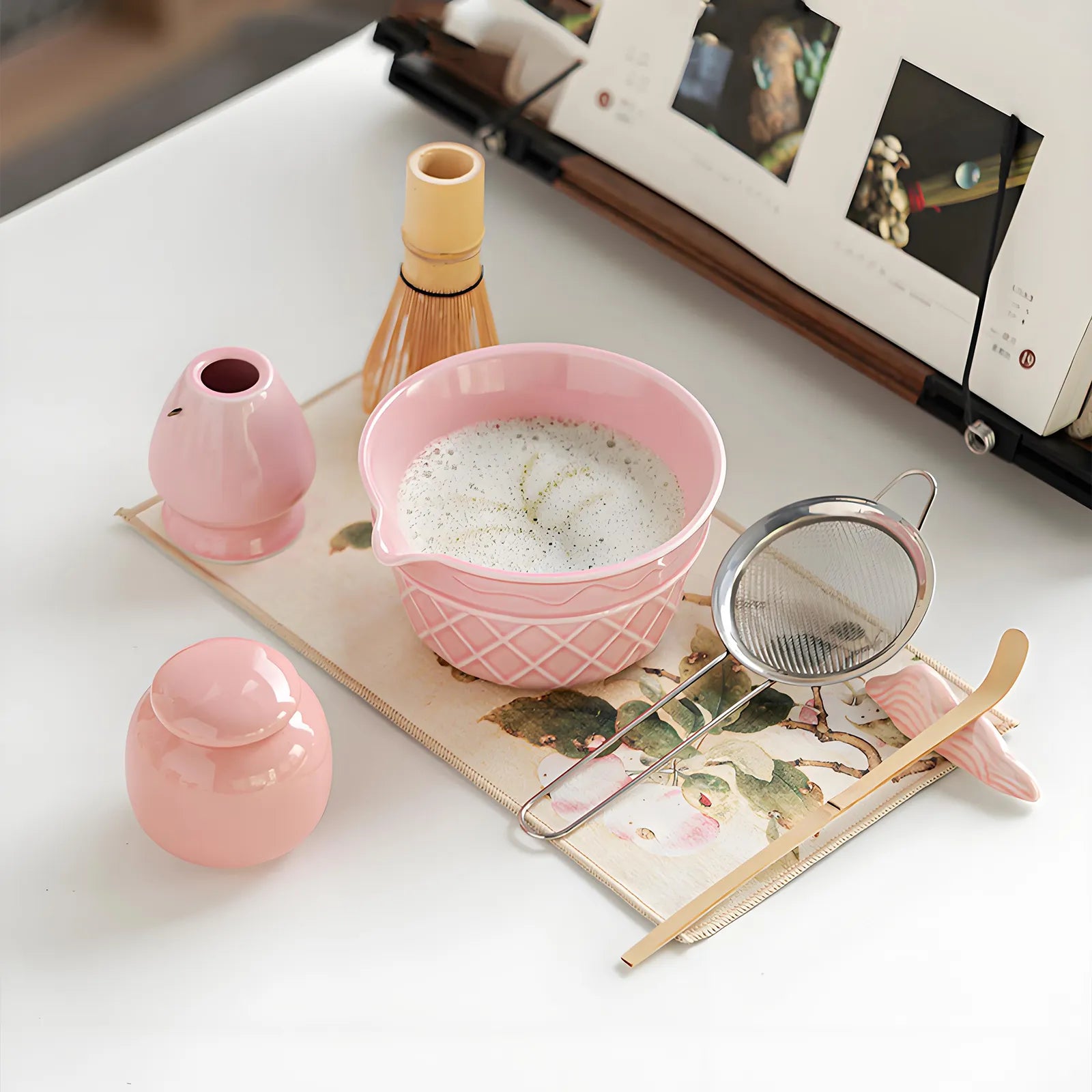 Complete matcha tea set with stainless steel sifter, whisk, chawan, and tools for traditional matcha preparation.