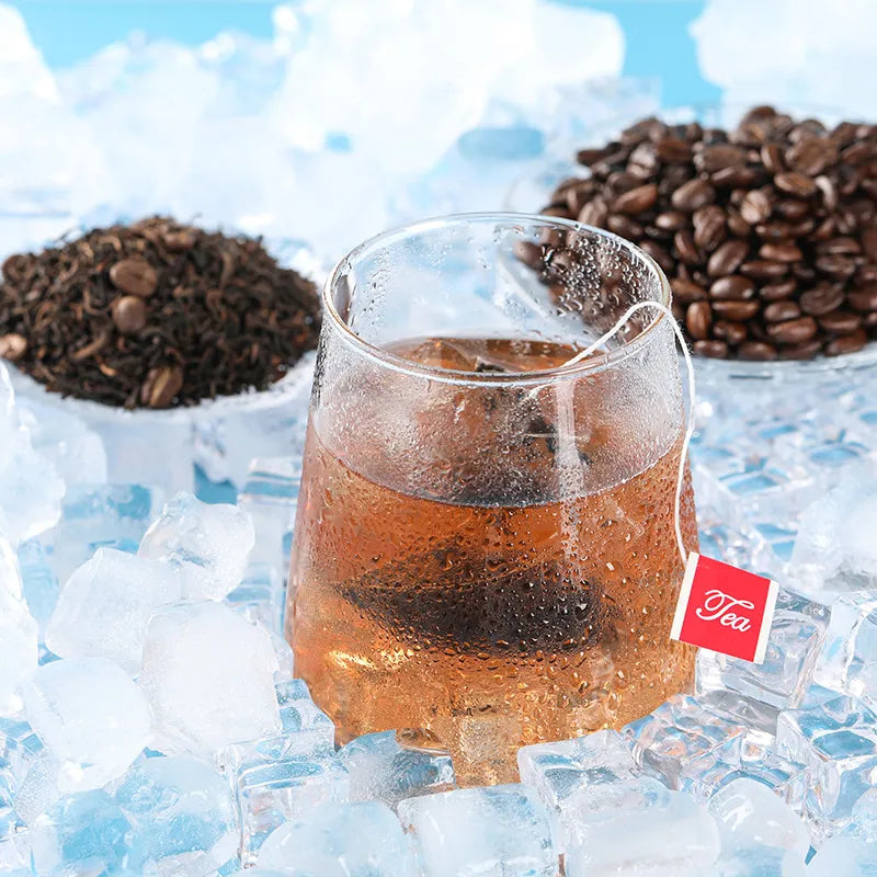 Top view of a cold brew setup with pu-erh tea and coffee beans arranged on both sides.
